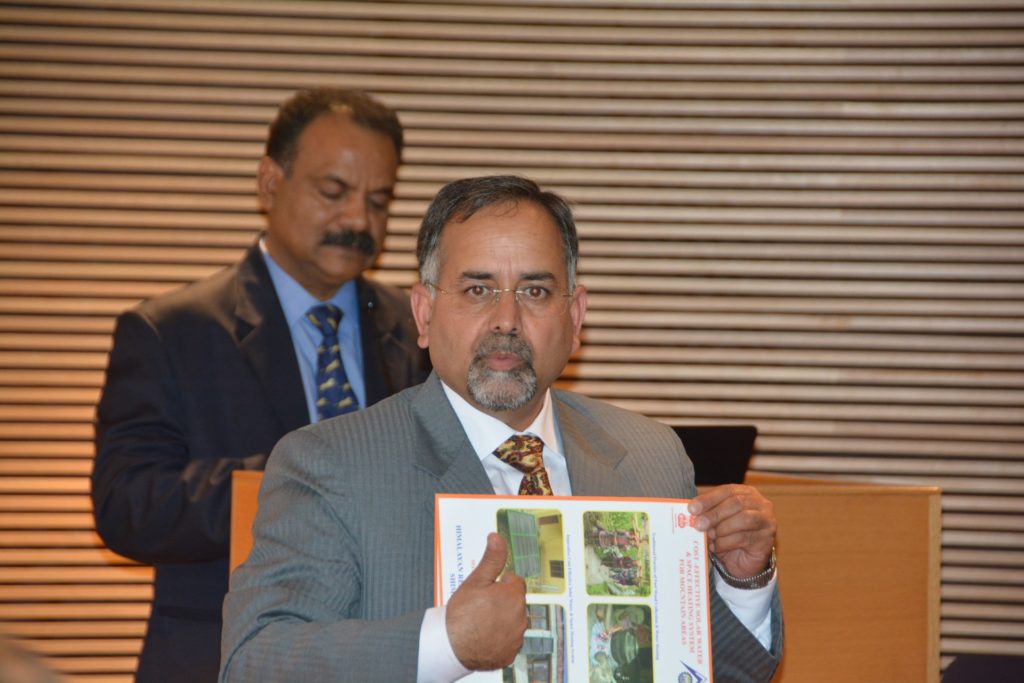 Man in a suit giving a presentation.