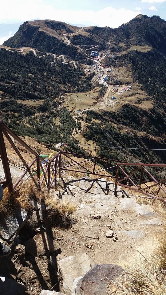 Mountain view with walking paths and a village.