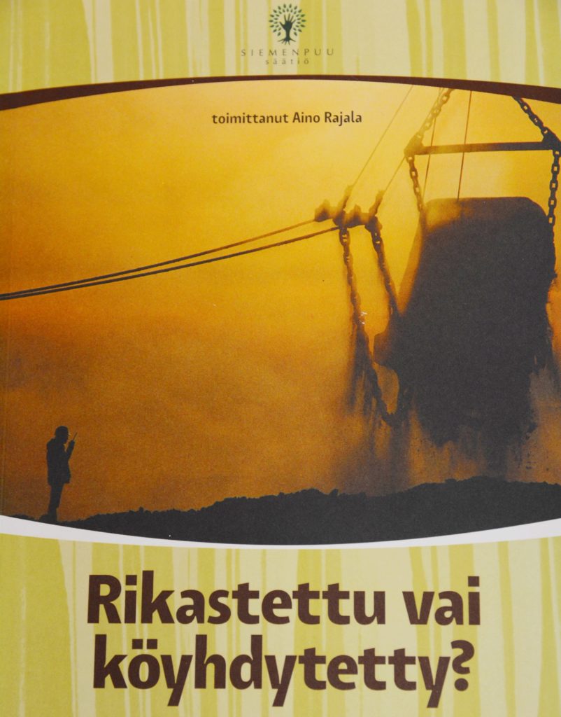 Book cover. In cover photo, a person stands next to a large digger.