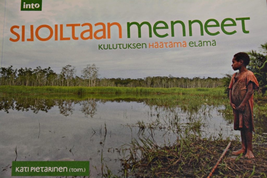 Book cover. In cover phto, a child stands next to a land filled with water.